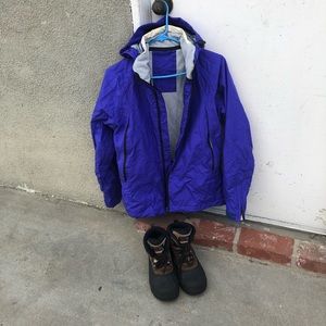Purple snowboarding jacket and snow boots